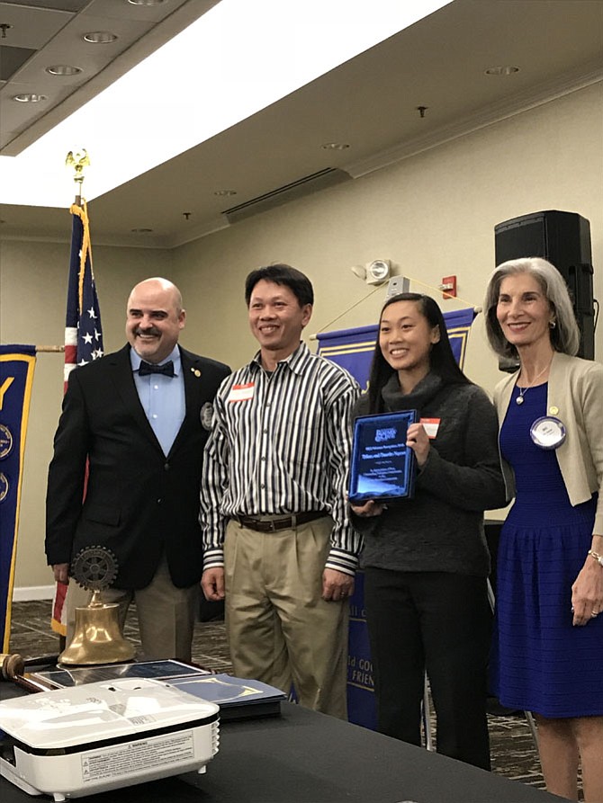 The Rotary Club of Herndon honored Tiffany Nguyen and her father Timothy as Outstanding Volunteers at the 52nd Annual Herndon Rotary Club Citizen of the Year and School Volunteer Recognition Banquet.  With them are Kurt Rose, Emcee/Member Herndon Rotary Club and Dee Casio, President Herndon Rotary Club. 