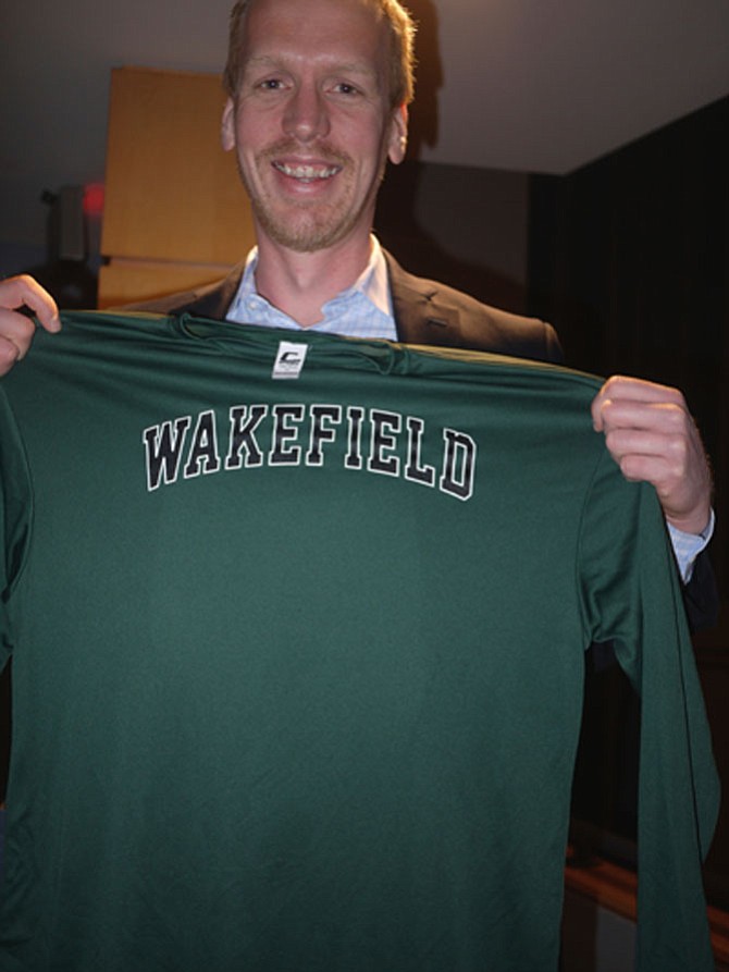 Eric Berkenpas enjoys making cameras that can get inside a forest fire, down to the deepest part of the ocean, and attached to deep sea creatures. He was given a Wakefield T-shirt by the students who heard him speak.