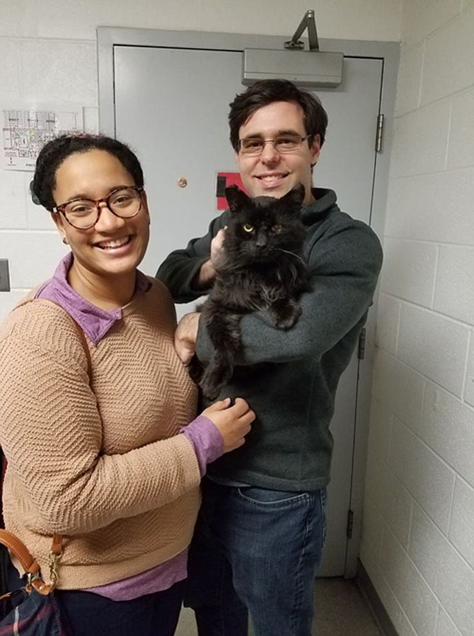 Sneaks’ long-awaited family, adopters Christina Thompson and Dane Howard.