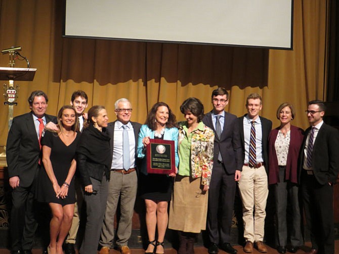 The Ticer family accepts the Women’s Hall of Fame award.