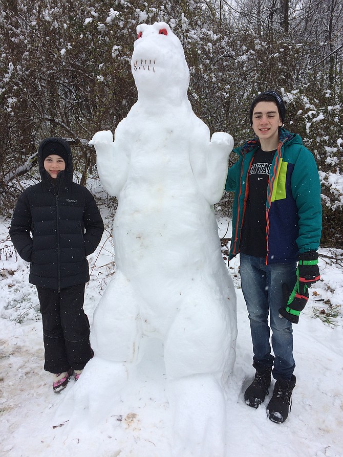 Mason and Lillian Gooder beside an 7ft-10in snow Godzilla they built. Mason is in ninth grade at James Madison HS and Lillian is in seventh grade at Thoreau Middle School. The photo was taken in Vienna, at Virginia Center townhouses.