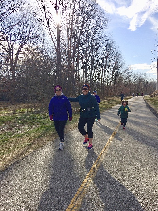 From left: Pam Silberstein, Gwen McQueeney, and her daughter Neave McQueeney train for the Arlington Thrive 5K. The runners appreciate those who make their run worth it by contributing to the fundraiser website at www.youcaring.com and searching under “Community” and Arlington Thrive. Neave is the youngest runner on the W&OD trail on a cold Saturday morning in March.