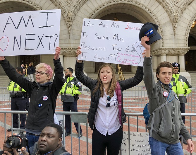Tanaquil Eltsov, 14, helped lead protest chants in front of Trump International Hotel on Pennsylvania Avenue at the March For Our Lives, Saturday, March 24. An eighth grader at Thomas Jefferson Middle School, she said, “I feel unsafe in school. Since Sandy Hook, kids of our nation have shown that we are not content with what’s going on in our country to address gun violence.” As a follow up to the march, Tanaquil said she will organize a Young Politicians TJMS club and podcast to involve her classmates in political action.