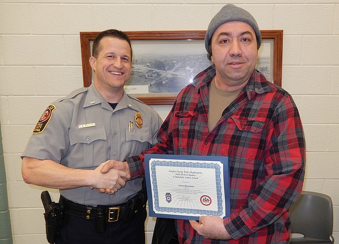 Lt. Ryan Morgan (left) presents a certificate to Anton Kazanjian.