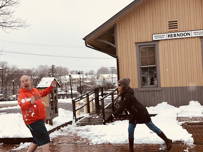 Mayor Lisa C. Merkel, Town of Herndon, nails Herndon Town Councilmember Bill McKenna spot on during an impromptu snowball fight challenge announced through social media on Wednesday, March 21. 