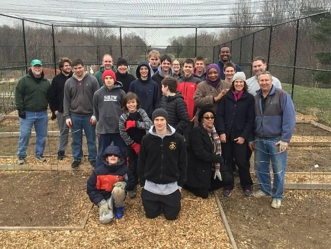 Thirty scouts, parents, and volunteers helped Cabell Kendall and Troop 160 improve the community garden.