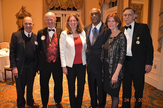 Mayor Allison Silberberg, third from left, poses for a photo with honorees at the Rotary Club of Alexandria’s Charter Night March 24 at Belle Haven Country Club. Pictured are: Paul Anderson, incoming Rotary president; Peter Knetemann, recipient of the Distinguished Rotarian Award; Silberberg; Lynnwood Campbell, recipient of the Gordon Peyton, Jr. Community Caring Award; Sharon Meisel, Rotary president-elect; and Mike Wicks, Rotary president.