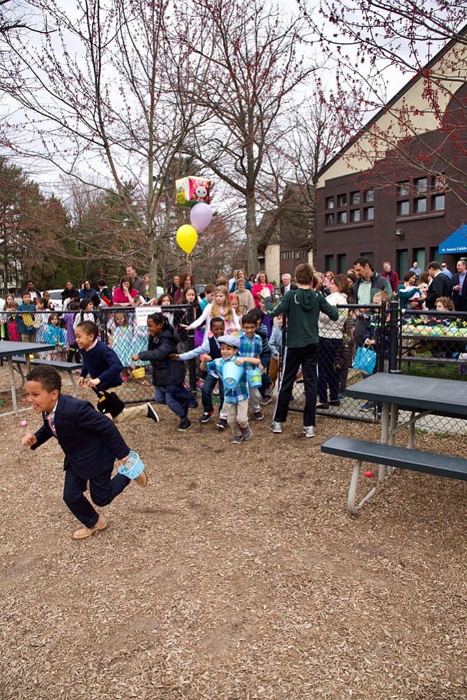 Children run to find the Easter eggs at the hunt hosted April 1 by St. James’ Episcopal Church, 11815 Seven Locks Road.