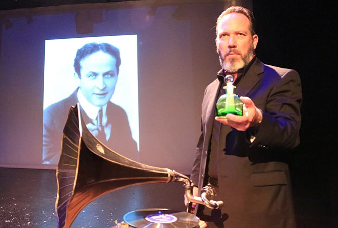 Lars Klores, as Orson Welles, with a photo of Harry Houdini and a “Victor Talking Machine,” the first record player.