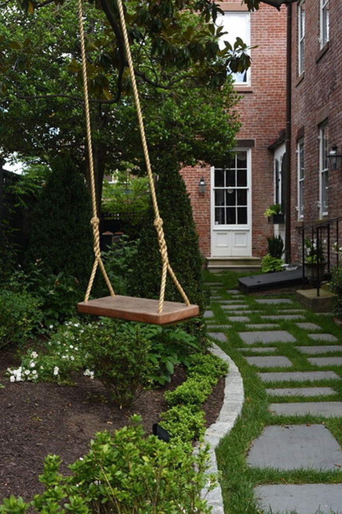 This garden at 209 South Saint Asaph St. was professionally redesigned in 2016 and includes gardenias, roses and climbing perennials. The early Victorian home was built by William McVeigh, a prominent merchant and citizen of Alexandria. The facade of the house has remained unchanged as pictured in a Mathew Brady Civil War era photo. The home’s interior is said to be the finest example of Greek revival in Old Town with original Corinthian columns and hand molded plaster work.