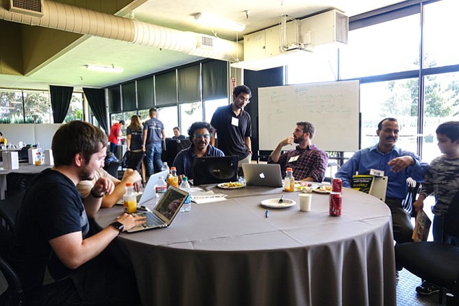 People work in teams and build out their data ideas in a Sunnyvale, Calif. hackathon in 2016.