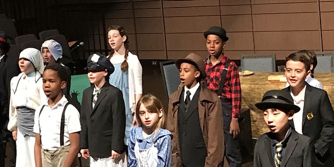 Fourth grade students perform an original play about immigration called “Journey to Freedom.”