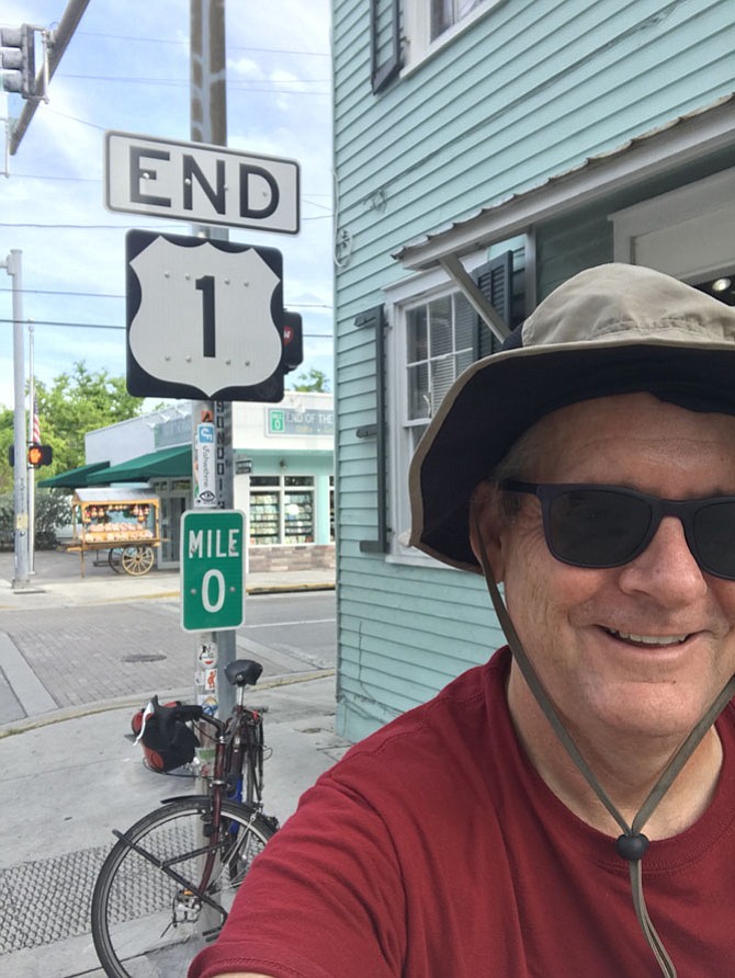 John Pickett at Mile 0 in Key West. Note the floppy hat he brought for the sun. It came in handy when the wind was blowing wet sand into his left eye coming down the Florida coast.