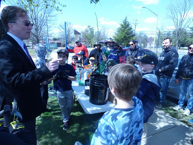 Del. Paul Krizek tells Scouts from Pack 888 that they will someday point with pride to the trees they are planting today.