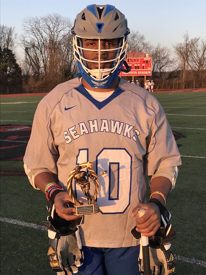 Spencer Alston, South Lakes High School lacrosse player, receives the 2018 Lou Peterson 'Respect the Game' Award at the Thursday, April 5, 2018 game against Herndon High School.