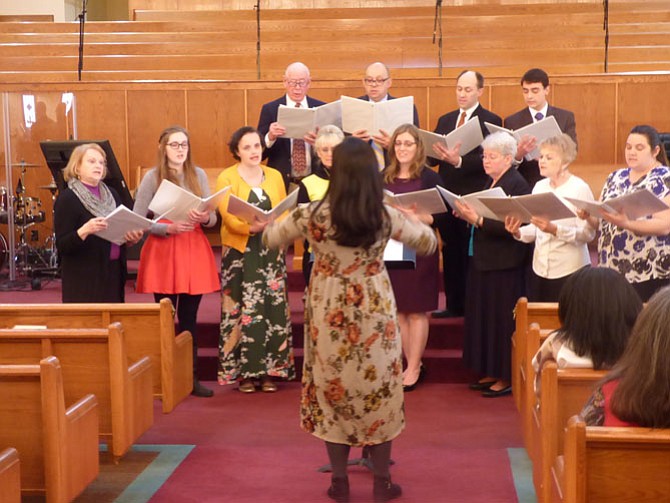 The choir from the Church of Jesus Christ of Latter-day Saints, Mount Vernon, with its director, Mary Nelson.