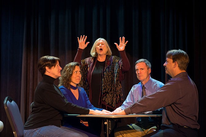 From left, actors Robey Manno as Violet Bradman, Katherine Metres Akbar as Ruth Condomine, Nancy Cahill portraying Madame Arcati, Allen McRae as Charles Condomine and Eric Storck portraying Dr. George Bradman rehearse a scene from “Blithe Spirit” when during a seance Madame Arcati makes contact with a little girl named Daphne who is her spirit "control."