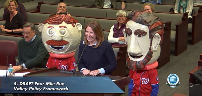 Catherine Lad speaking in support of Arlington’s parks with her sons Andrew (left, as Teddy Roosevelt) and Matthew (right, as Abraham Lincoln).