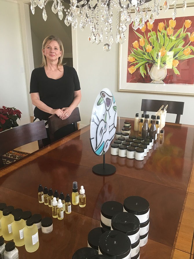 Potomac resident Renan Kennedy, creator of Sans Skincare natural products, shows some of her products at her home on Thursday, April 12. She started a line of natural skincare products after searching for soothing moisturizers for her mother, who was undergoing chemotherapy.