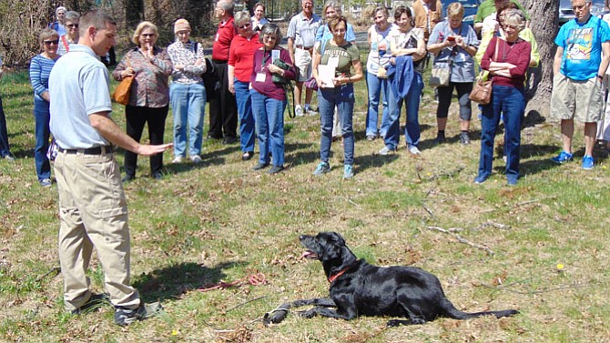 Paul Serzan, a Firefighter Paramedic and K9 Handler with the Virginia Task Force 1, works with his dog Angus.