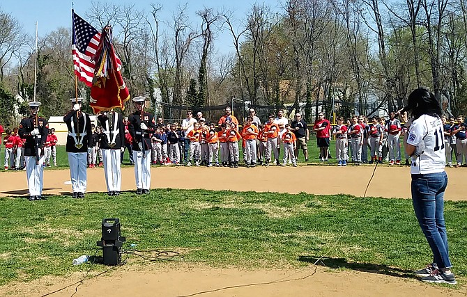 The Marine Corps Color Guard joined the Alexandria Potomac Little League from the Marine Barracks, Washington D.C. on Saturday, April 14. The parent singing the National Anthem is Karen Moreno Sayles.