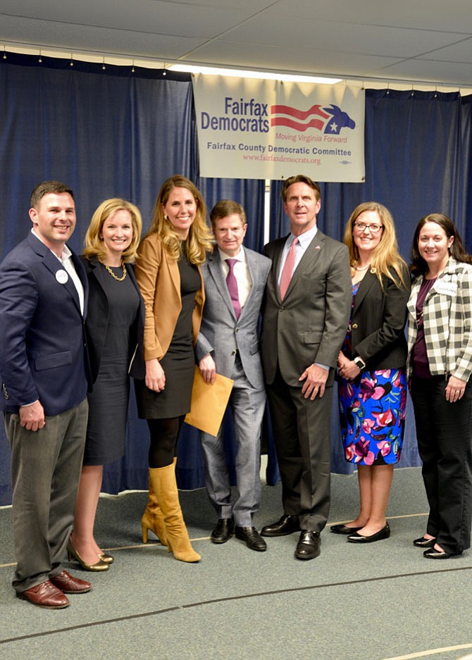 The Democratic candidates vying for the chance to challenge incumbent Rep. Barbara Comstock’s Congressional District 10 seat. From  left, Dan Helmer, Lindsey Davis Stover, Alison Friedman, moderator Glenn Kessler, Paul Pelletier, State Sen. Jennifer Wexton, and Dr. Julia Biggins.