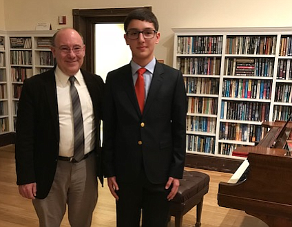 Conductor Robert Pouliot with guest artist Diego Stine, Tuba, George C. Marshall High School.