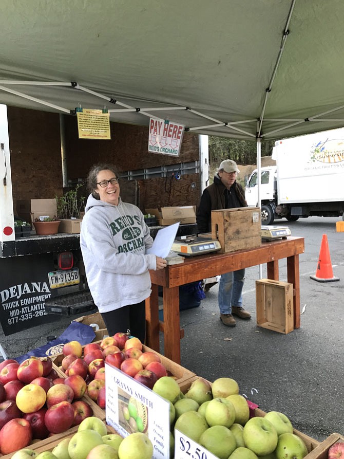 Vendors at Reid's Orchard are nearly ready for the first day of the Reston Farmers Market.