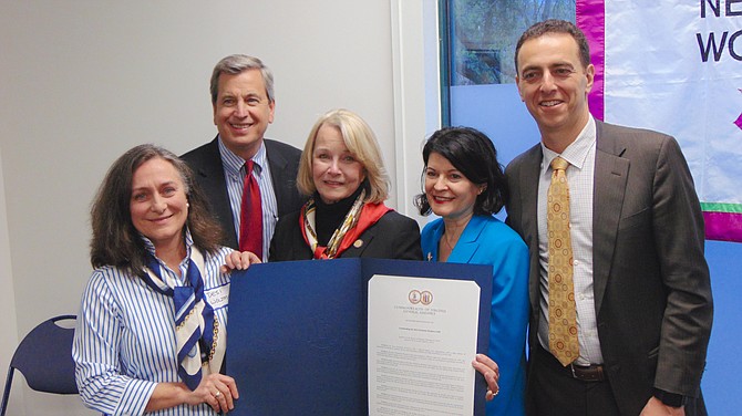 From left, Desi Woltman, Del. Rip Sullivan, Del. Kathleen Murphy, Sen. Barbara Favola, and Del. Marcus Simon with the proclamation presented by Murphy.
