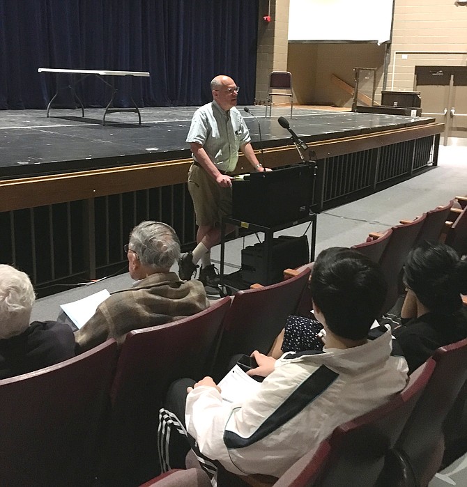 Richard Boltuck begins a meeting to discuss Maryland State Highway Administration changes to River Road at Walt Whitman High School Monday night. The changes focus on safety improvements at the intersection of Braeburn Parkway and River Road and the pedestrian crosswalk east of that intersection.