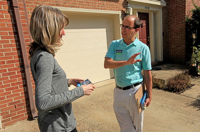 Vice Mayor Justin Wilson talks with Myla Sisk, April 14.