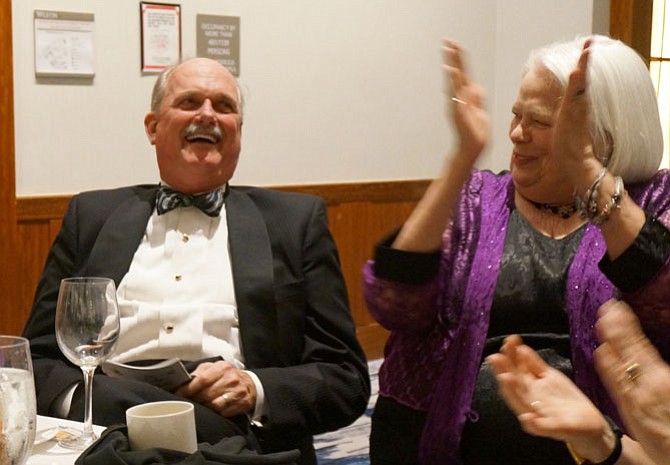 Julie Lineberry, right, applauds Adron Krekeler as the winning bidder on the chance to drive a Lamborghini Huracan at the April 14 SOLA ball.