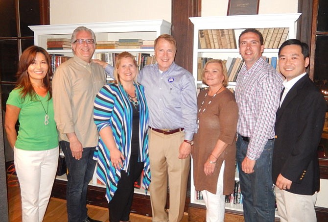 Surrounding Mayor David Meyer (center) are Council members (from left) So Lim, Michael DeMarco, Jennifer Passey, Janice Miller, Jon Stehle and Sang Yi.