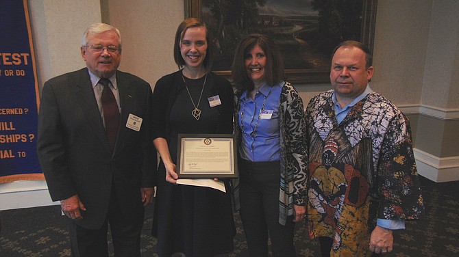 Sarah Wood, third-grade teacher at Rolling Valley Elementary (holding plaque); with Mike Becraft (left), Master of Ceremonies; Maureen Boland, principal of Rolling Valley; and Ralph Menzel, president of the Springfield Rotary Club.