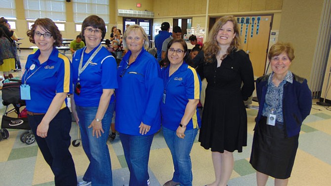 From left: Lisa Koch, Lee High Librarian; Mimi Marquet, Lee High Head Librarian; Deirdre Lavery, Principal of Lee High School; Lourdes Salas, Administrative Assistant; Priscille Dando, Coordinator of Library Information Services with Fairfax County; and Denise Katz, Assistant Principal at Lee.