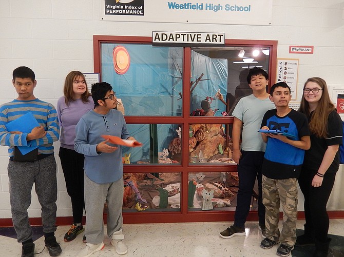 From left: Students Jefry, Sedona, Fernando, Bruce, Brandon and Brittany by the display.