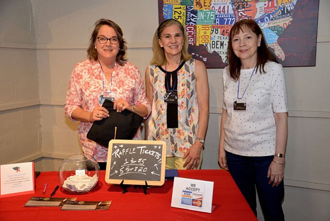 From left, Barbara Chen, Lissa Carter and Candace Bovee. The three board members of the Great Falls Friends and Neighbors Scholarship Fund were front and center at the fundraiser at Mookie’s BBQ of Great Falls, encouraging patrons to donate or buy raffle tickets.