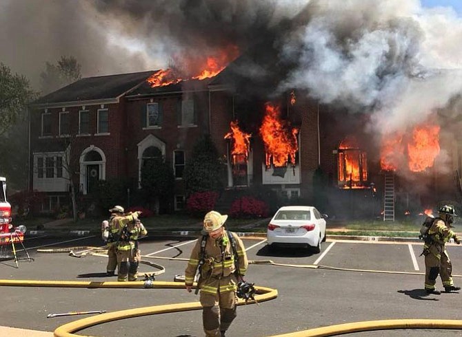 Flames and firefighters at the townhouses in Sully Station II.