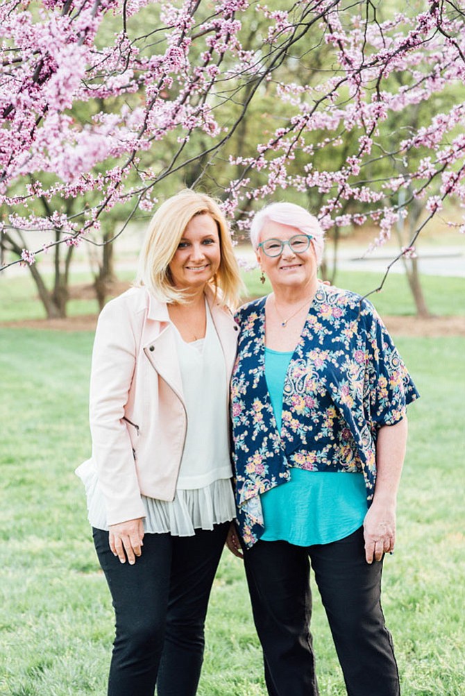 Enjoying Cherry Blossoms in Reston: Mother Maggie Campbell (right) and her daughter Meg Donnelly, 43, both of Reston, visit Hyatt Park in Reston Town Center to enjoy the last of the Cherry Blossom blooms on April 26, 2018.
