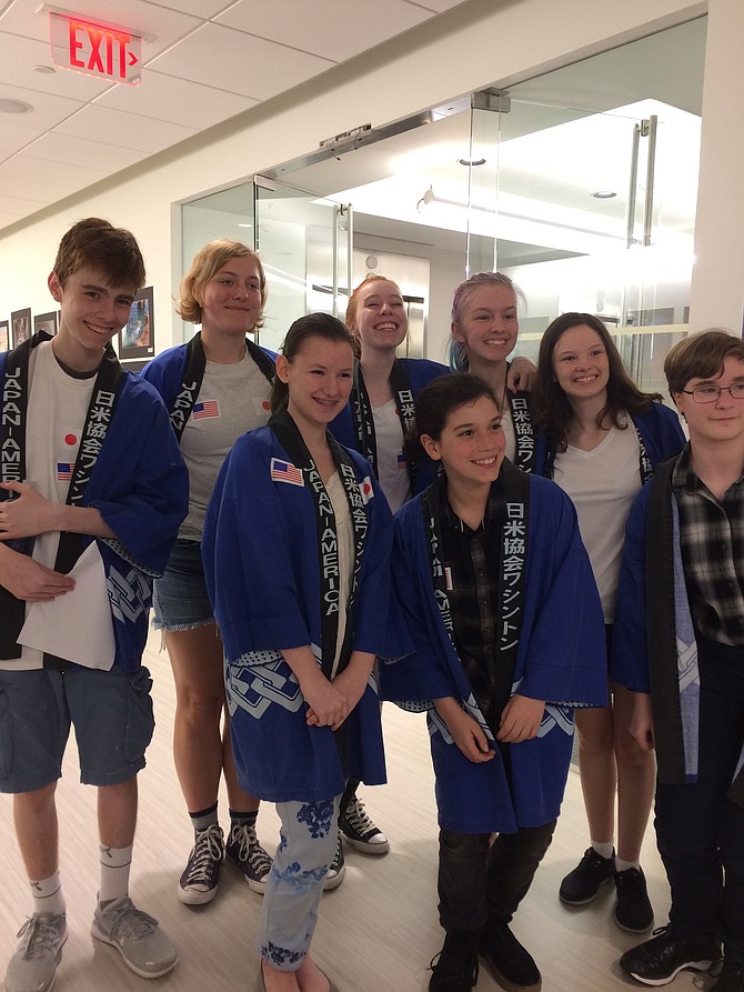 From left: Conor Hogan, Allison Lee, Juliana Logan, Winnie Brent, Liam Mason, Cate Hogan, Mary Bennett, and Cordelia Medrick advocate for world languages at May 3 School Board meeting.