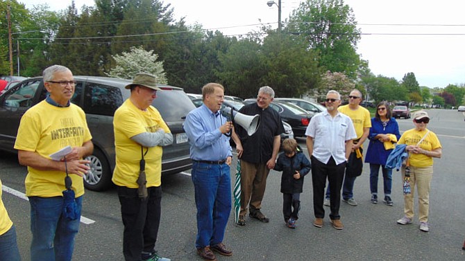 City of Fairfax Mayor David Meyer (with bullhorn) addresses the crowd before the walk.