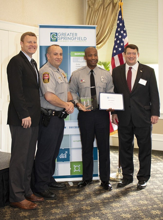 Supervisors Jeff McKay (D-Lee), Lieutenant Gregory Fried, Assistant Commander, Franconia District Station, Officer Isa Martin and Supervisor Pat Herrity (R-Springfield) at the ceremony.