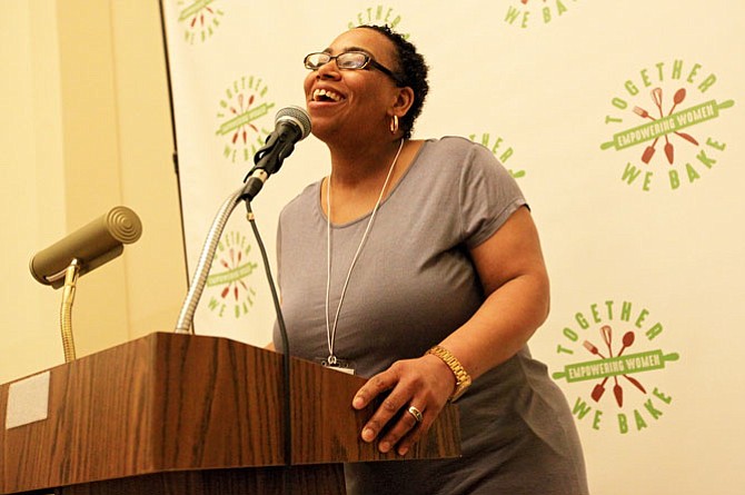 Together We Bake program manager Colida Johnson speaks at the nonprofit's second annual empowerment breakfast.