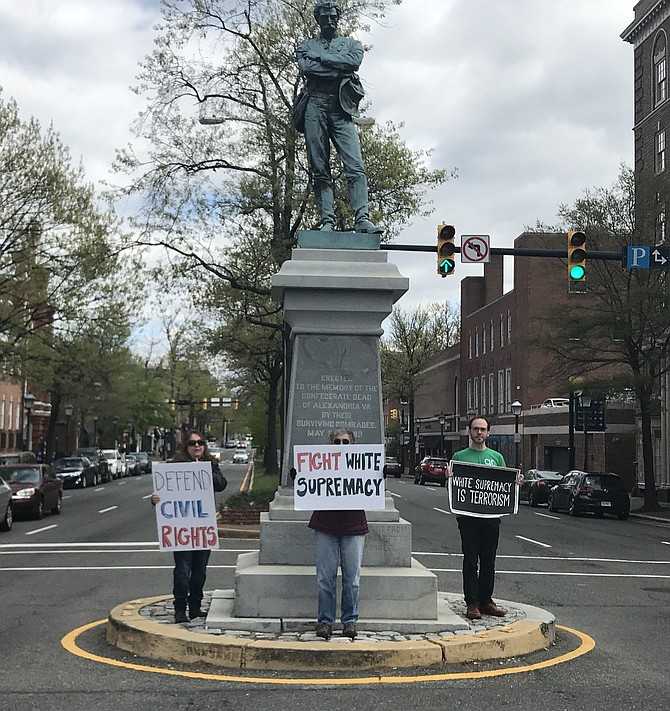 Members of Grassroots Alexandria in front of the Confederate monument in Old Town.