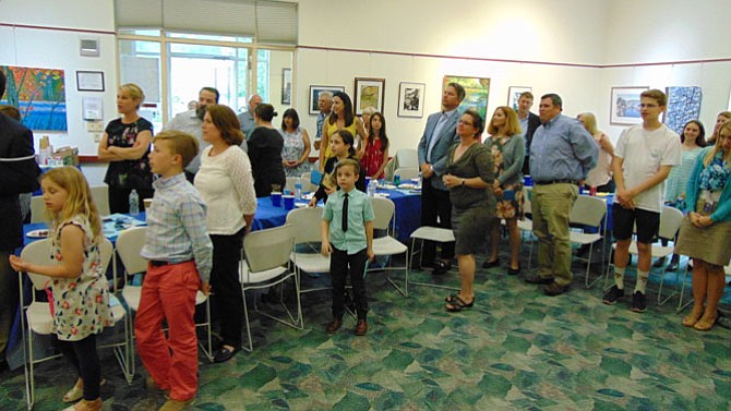 The crowd recites the Optimist’s Creed at the Great Falls Optimist Club Awards Ceremony held on Thursday, May 10, 2018, at the Great Falls Library.