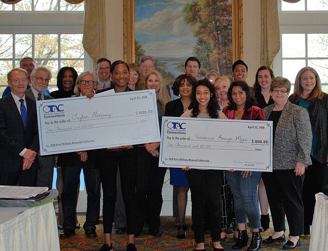 West Potomac High School senior Taylor Petteway and T.C. Williams High School senior Veronica Araujo each holds a check for $1,000 at the presentation of the Peter Williams Memorial Scholarship during the April 25 Old Town Alexandria Connections meeting at Belle Haven Country Club. With them are Araujo’s mother Alicia Mejia and members of the OTAC business organization.