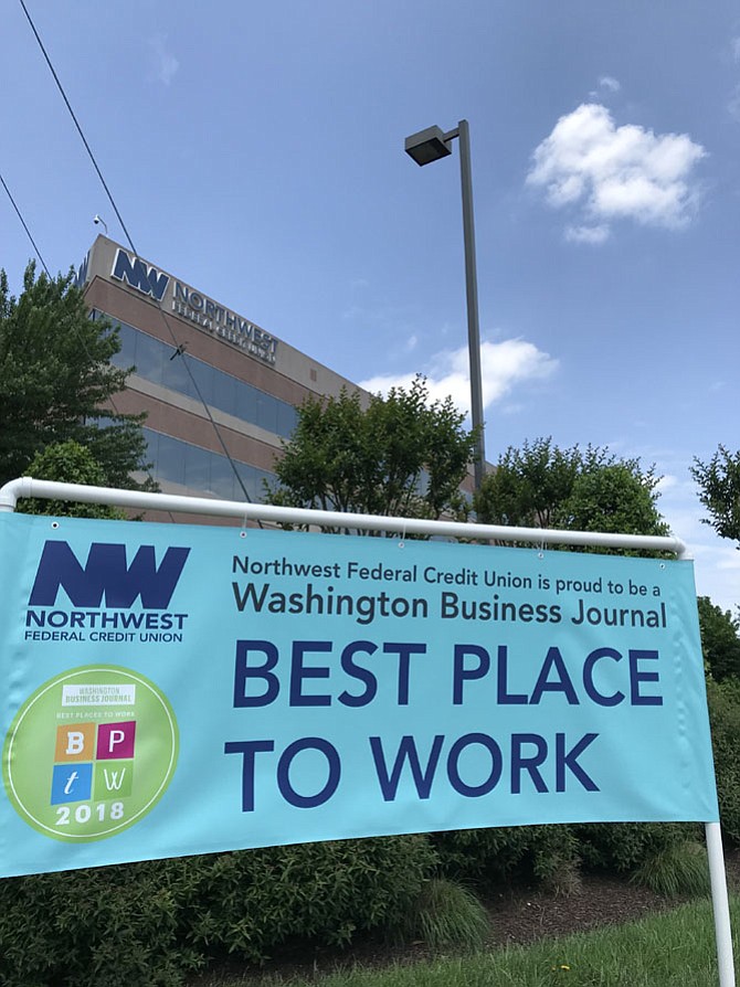 NWFCU announces Washington Business Journal selected the Herndon headquartered financial institution as one of the Best Places to Work. The banner is located in front of their campus at the corner of Herndon Parkway and Spring Street in the Town of Herndon. 