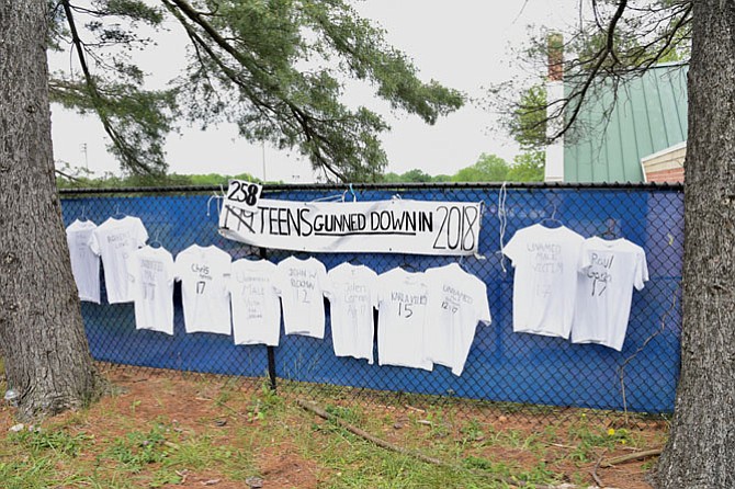 More than 200 shirts with the names of teens killed by gun violence were displayed on a fence at Winston Churchill High School on Monday morning, May 21; 258 students have been shot and killed in 2018.