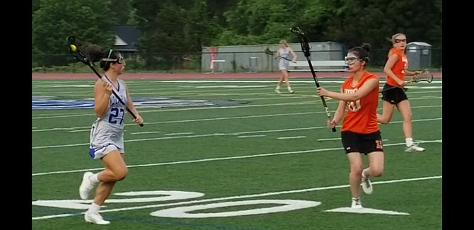 West Potomac senior Jackie Bewick, left, scored three goals against Hayfield on Tuesday.
