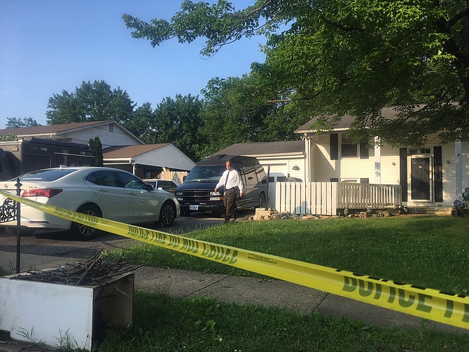 The crime scene — a house on Steadman Street — was surrounded by yellow tape.